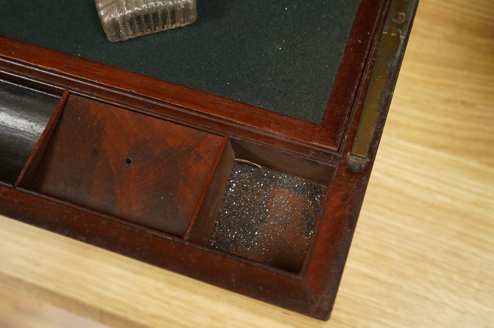 A bird’s-eye maple tea caddy and a brass mounted writing slope, latter 50cm wide